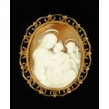 A carved shell cameo brooch in 9 ct gold mount, depicting Madonna,