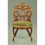 An America Belter laminated chair, with pierced scrolling back,