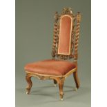 A Victorian rosewood nursing chair,