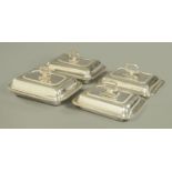 Four silver plated rectangular serving dishes, three with gadrooned rims, one with beaded.