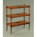A early 19th century rosewood three tier whatnot,