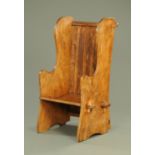 A light elm lambing chair, circa 1900, with slatted back, shaped side and two plank seat.
