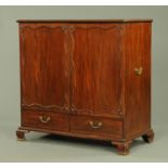 A late George III mahogany dwarf linen press,