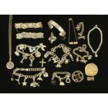 A quantity of silver jewellery, to include five charm bracelets, a bangle, three further bracelets,