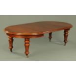 A Victorian mahogany wind out extending dining table, with D shaped ends and moulded edge,