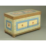 A Victorian painted pine mule chest, with interior drawers and raised on bun feet. Width 122 cm.