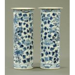 A pair of Chinese blue and white sleeve vases, late 19th century, having an inverted rim,