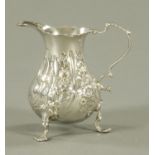 A Georgian silver cream jug, makers initials CD, London 1759,