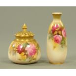 A Royal Worcester pot pourri vase, decorated with roses, and a similarly decorated vase,