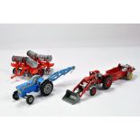 Group of older diecast tractor issues comprising Corgi Ford and Massey Ferguson duo with attachments