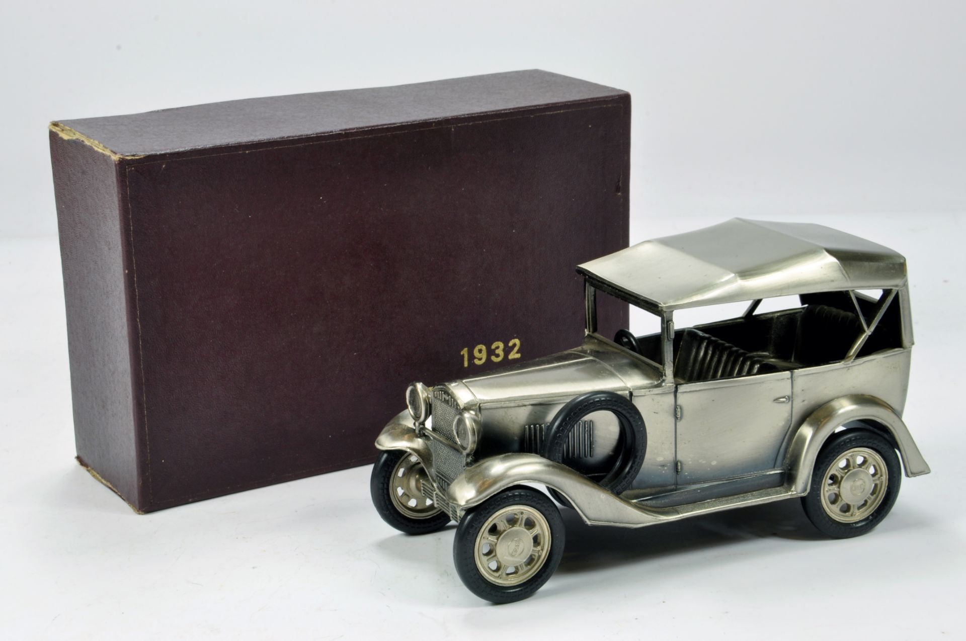 Silver Plated model of a 1932 (first) Nissan / Datsun vehicle.