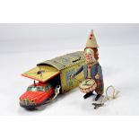 Interesting Schuco Tin Plate Duo including Clown with Drum and Car and Garage. Untested but