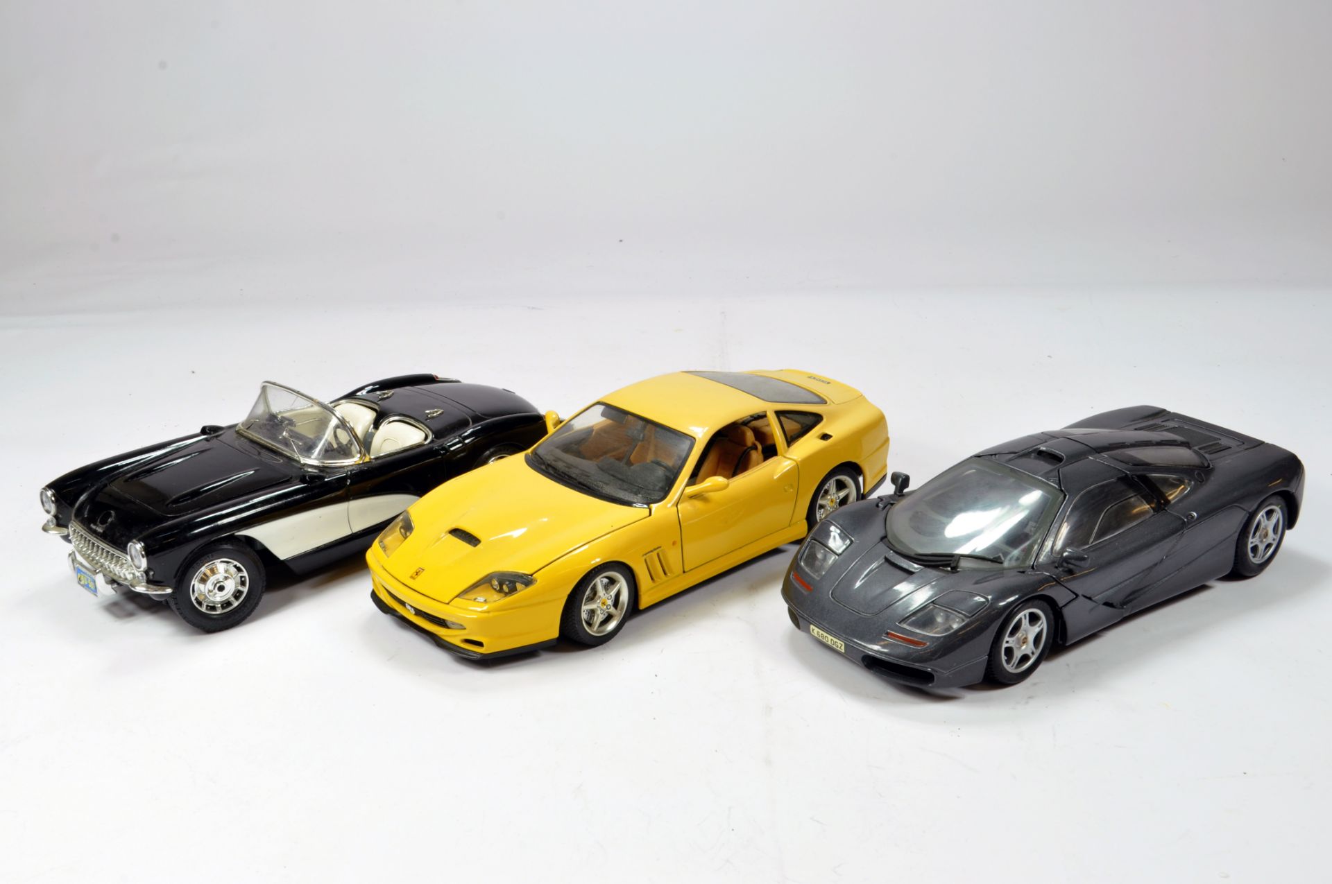 Diecast 1/18 car selection comprising various issues; Ferrari, Jaguar etc. Generally VG to E. (3)