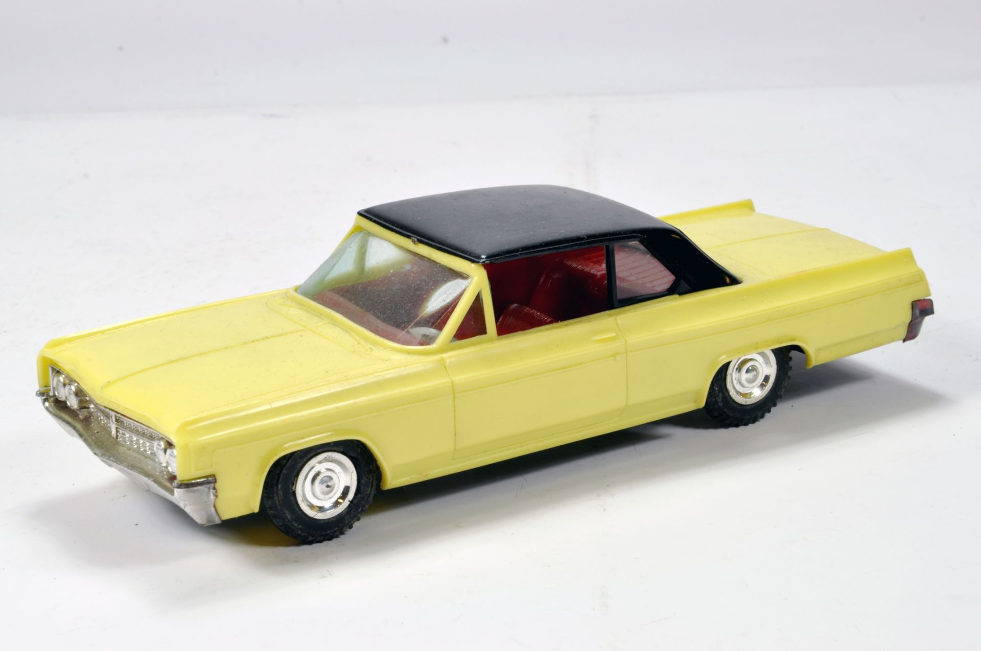 Plastic Empire Made large scale model of a Cadillac in cream with black hood and chrome trim. G to