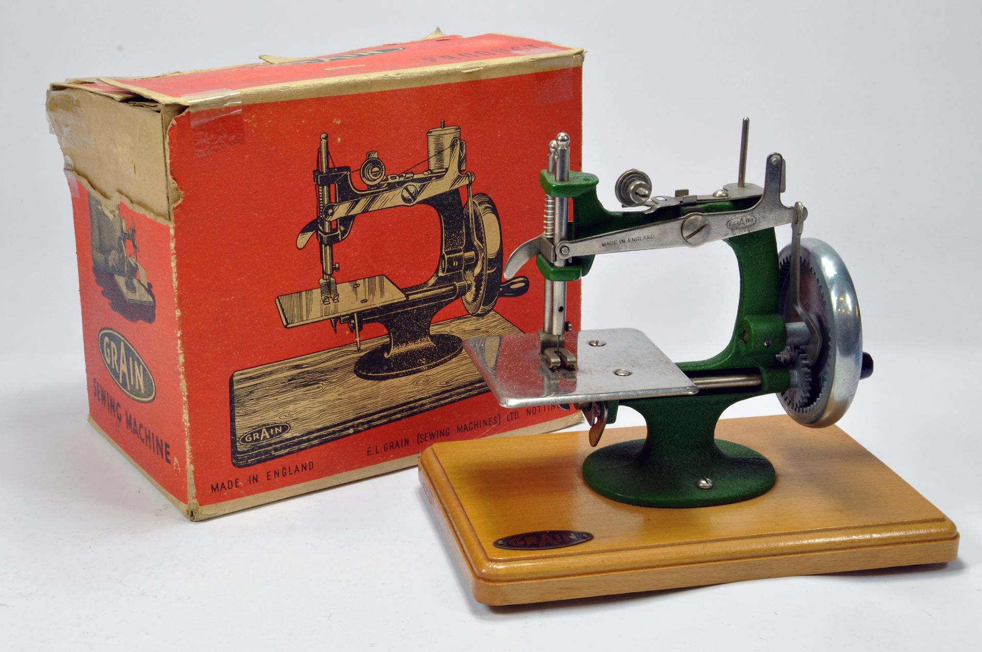 A Grain Metal Made Toy Sewing Machine. This well preserved issue appears complete and comes with