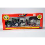 Britains 1/32 Farm Diecast model comprising Valtra Valmet 115 Forest tractor and trailer set. NM