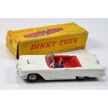 French Dinky No. 555 Ford Thunderbird Cabriolet with white body, red interior and figure. NM in G