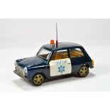 An approx 1/20 scale model of a Mini with Policia livery. Friction driven with roof beacon and