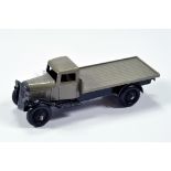 Dinky No. 25c Flat Bed Truck with fawn cab and back, black chassis and ridged hubs with black tyres.
