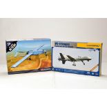 Duo of plastic model kits comprising drone models. Vendor informs kit is complete.