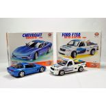 A duo of Burago issue Diecast Kit Built Vehicles. Chevrolet Corvette and Ford F150. Generally VG