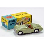 Corgi No. 305 Triumph TR3 Sports Car in flat pale green, red seats, silver trim plus spun hubs.