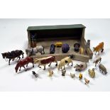 An interesting group of metal figures and wooden building including Farm Animals. Britains and