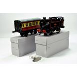 Hornby O Gauge Tin Plate comprising Locomotive and Passenger Coach. Beautiful condition hence E to