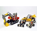 Various built lego models including excavator and others.