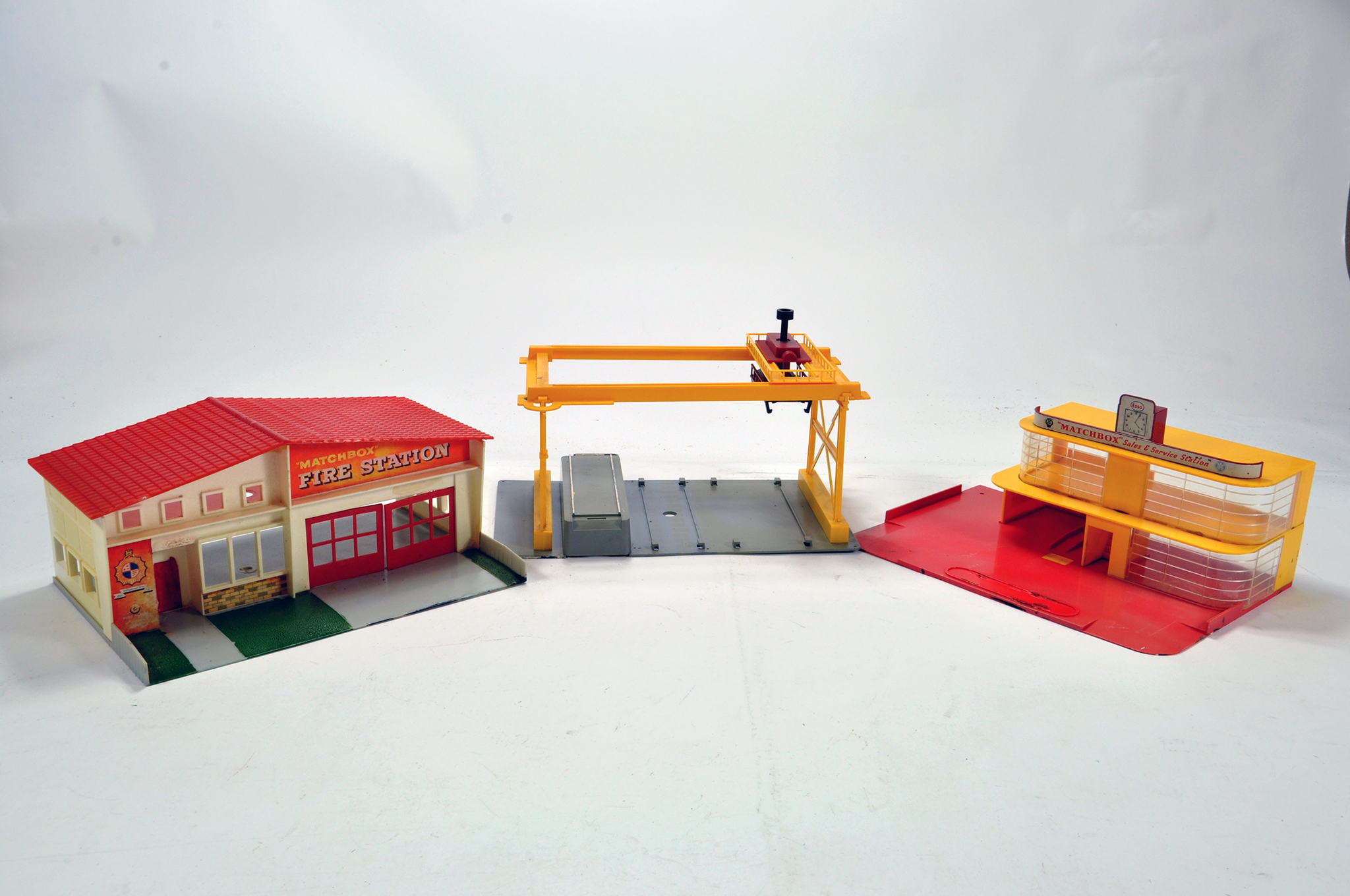 Trio of Matchbox buildings including Fire Station, Garage and one other. Generally F to G.