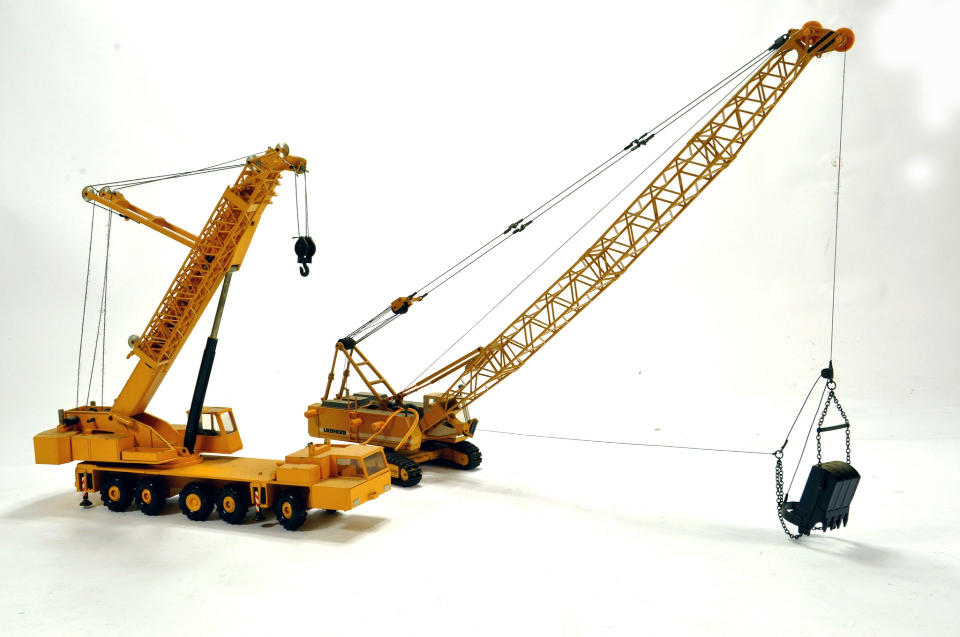 Duo of diecast construction issues in 1/50 comprising Mobile Crane and Liebherr Line Excavator.