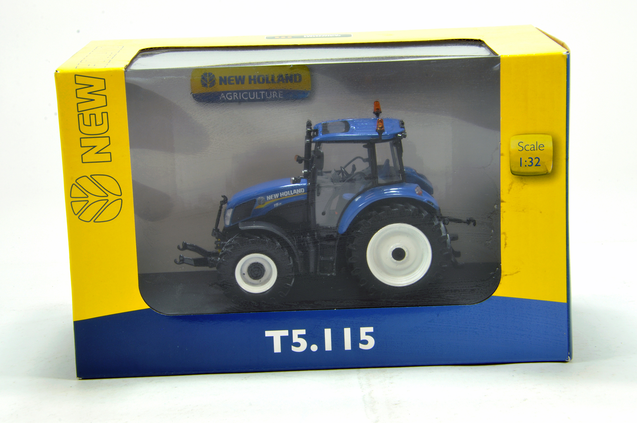 Universal Hobbies 1/32 farm issue comprising New Holland T5.115 Tractor. NM to M in Box.