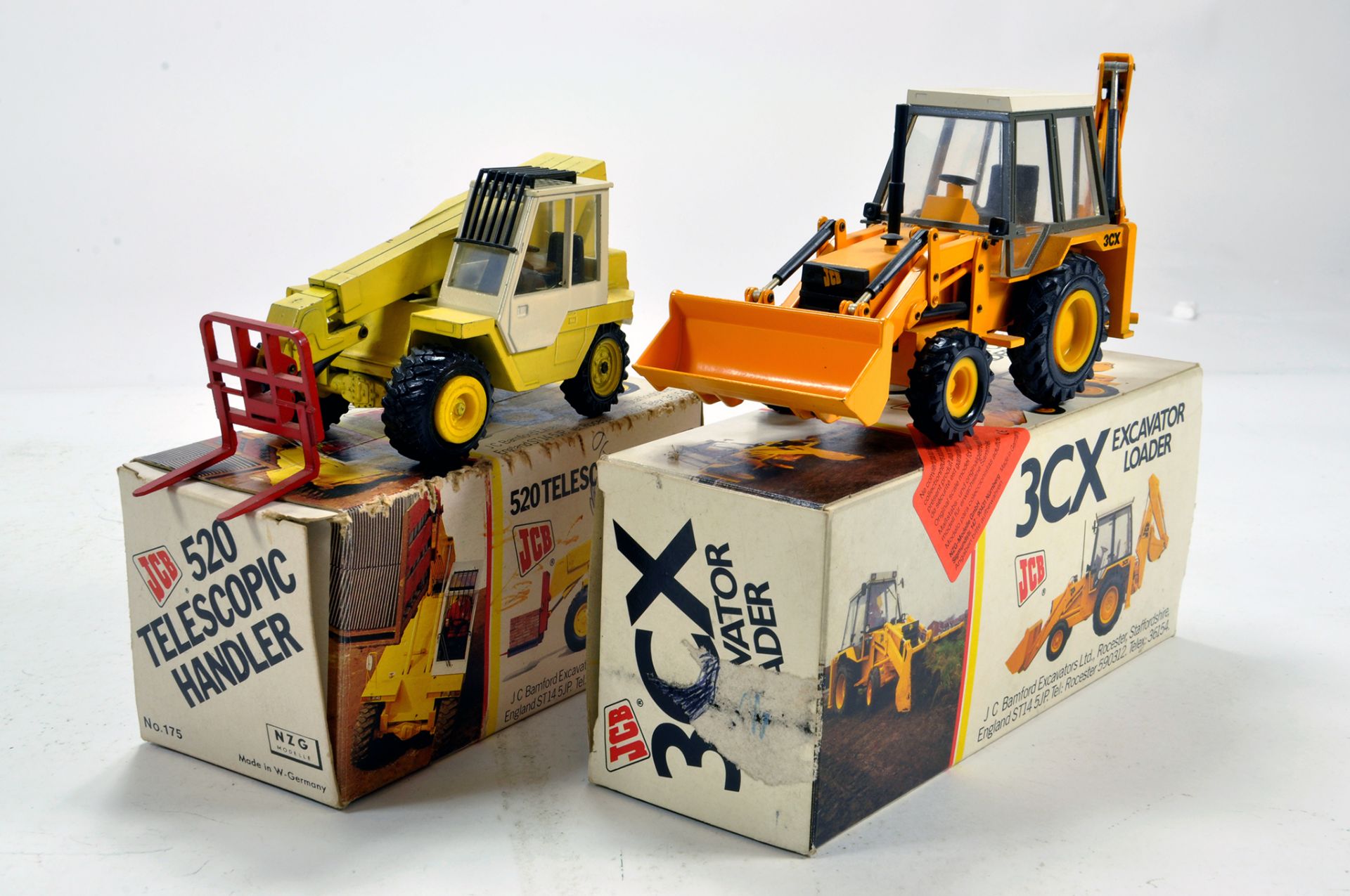 Duo of NZG JCB issues comprising 520 Telehandler and 3CX Excavator Loader. VG to E in Boxes. (2)