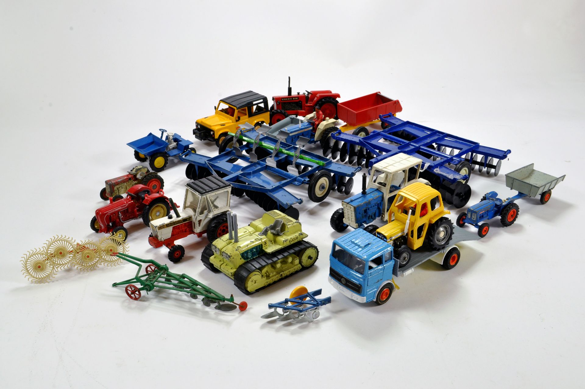 Misc assortment of Farm items comprising Tractor and Implement items. Various Makers. Britains