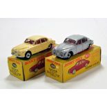 Dinky Toys duo comprising No. 195 Jaguar 3.4 Saloon in Cream and one in Grey. Generally F to G and G