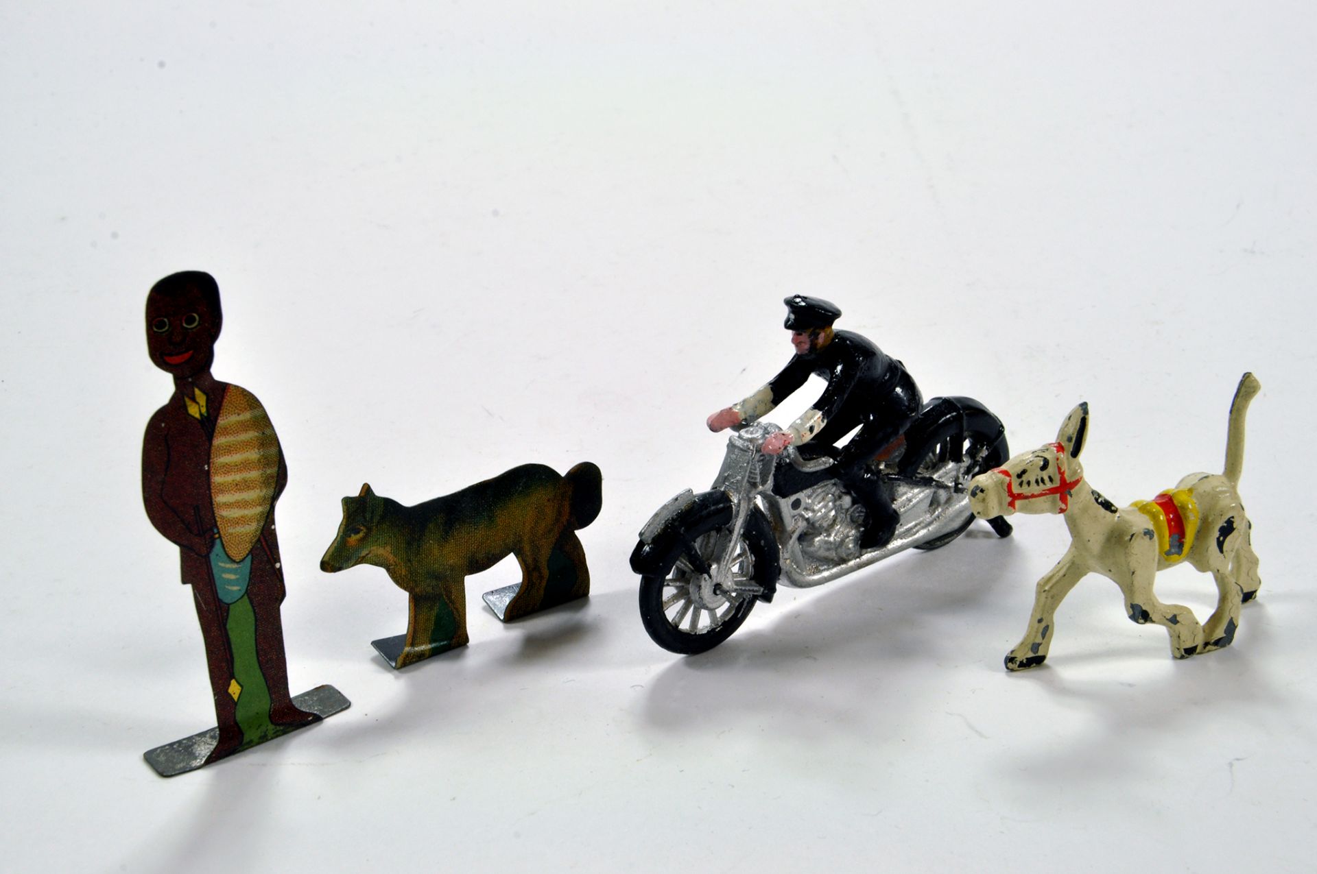 An interesting group of metal figures, Police Motorbike and flats comprising rare issues. Sacul?