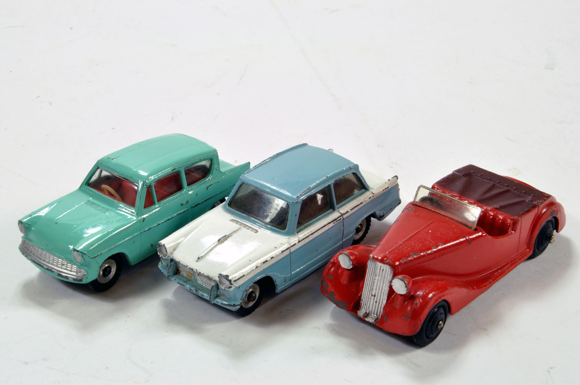 Dinky Trio of Diecast Car Issues comprising Triumph Herald, Ford Anglia and Sunbeam Talbot.
