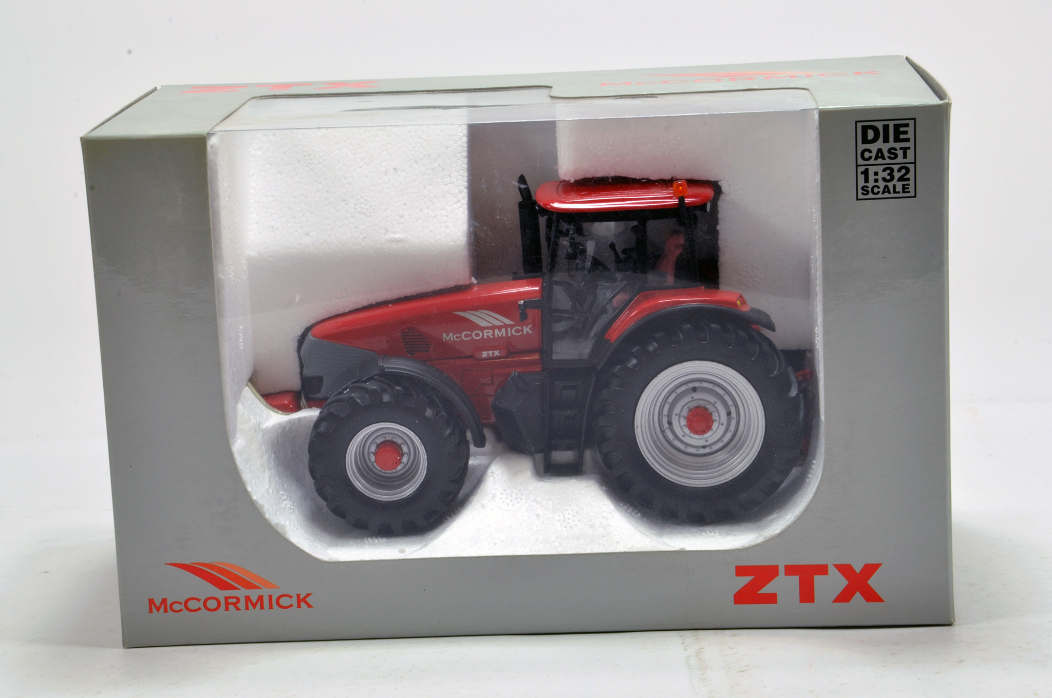 Universal Hobbies 1/32 farm issue comprising McCormick ZTX Tractor. NM to M in Box.