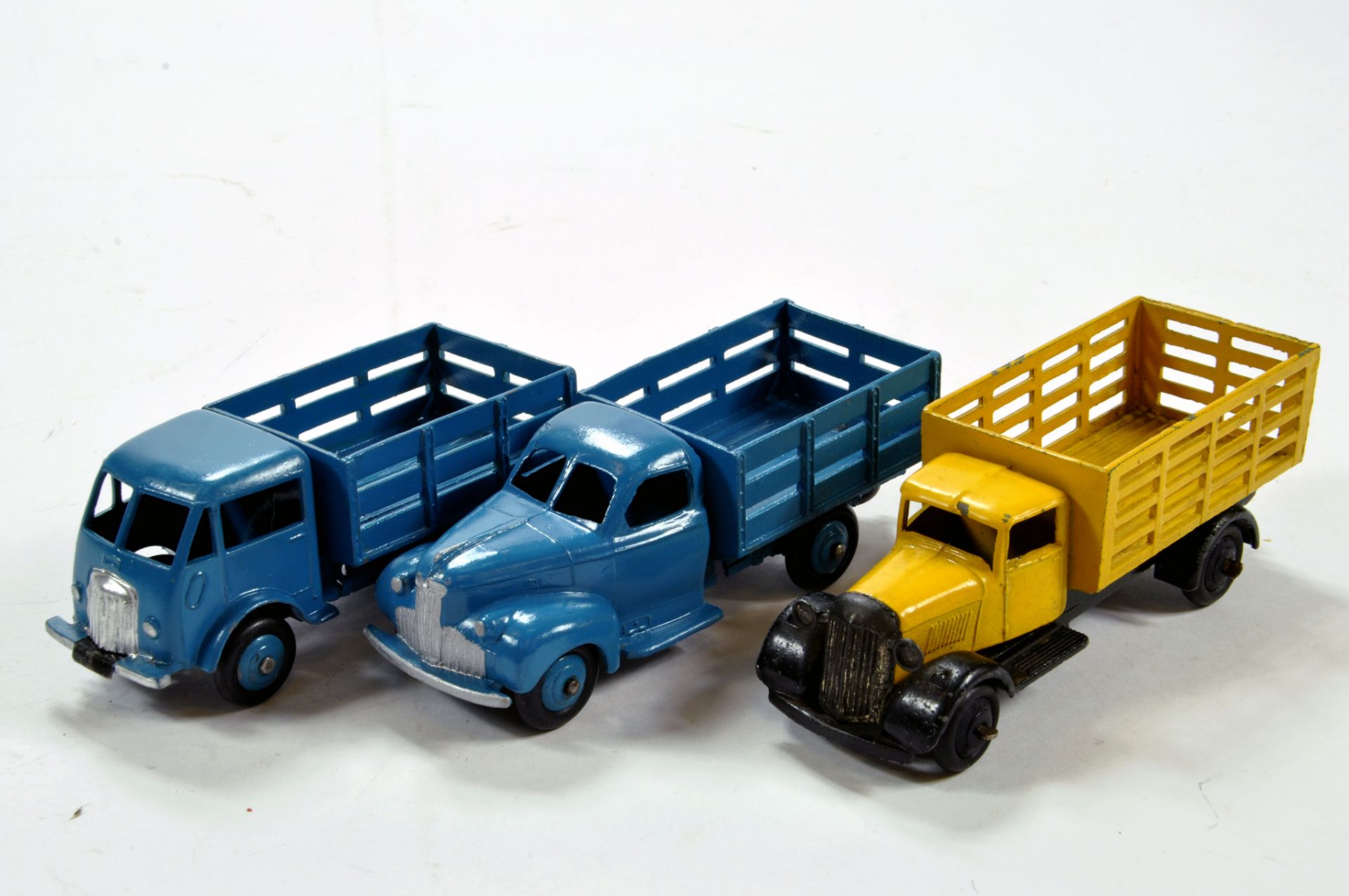 Dinky Trio of Diecast Commercial Issues comprising Ford Stake Truck (repainted), Market Gardeners