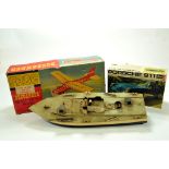 Trio of Toys comprising FROG Buccaneer, Revell Porsche Kit (started) and boat. (3)