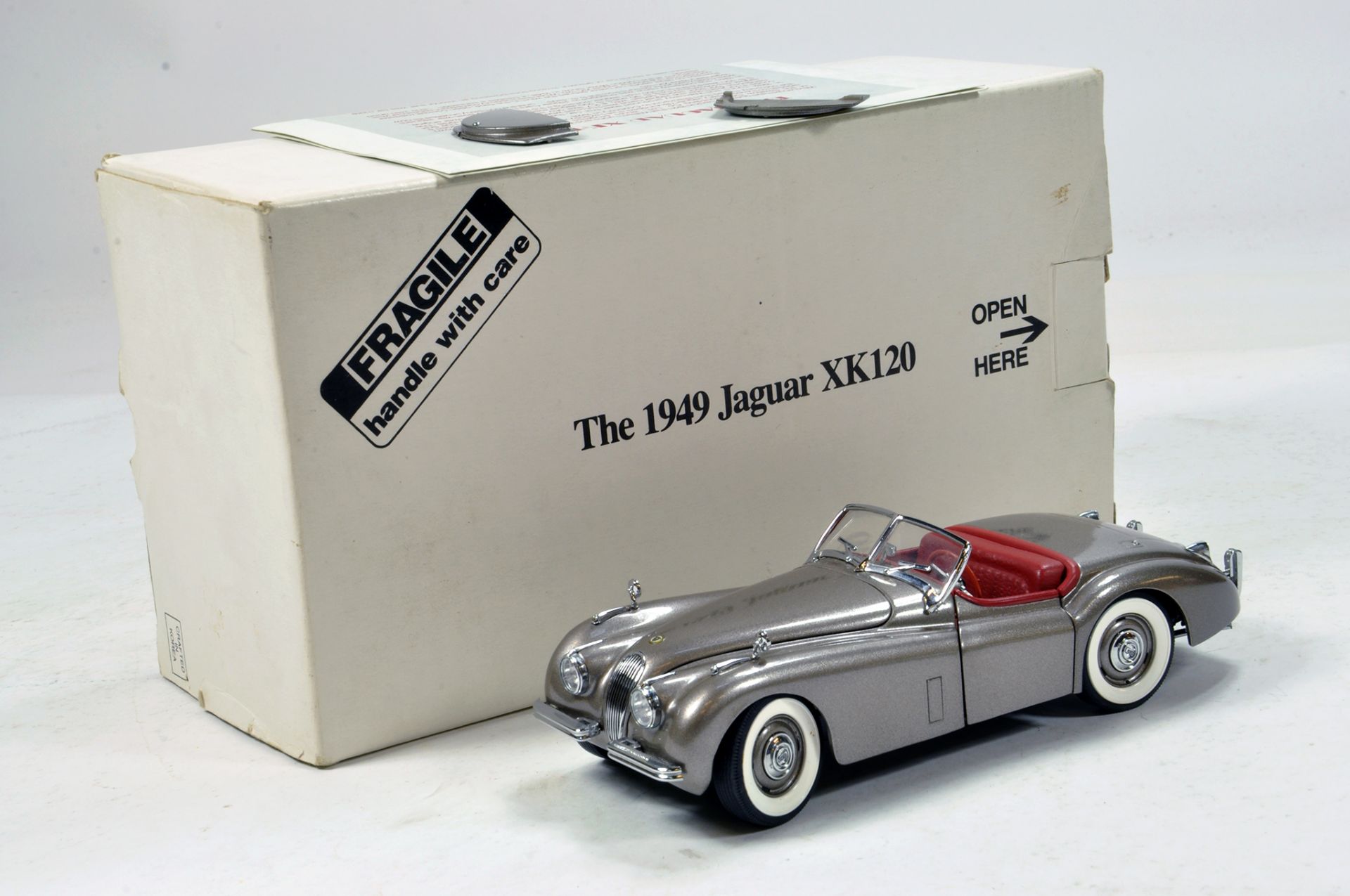 Franklin Mint 1/24 1949 Jaguar XK120. Impressive highly detailed piece that displays well hence E to