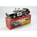 Ichiko Battery Operated Radar Police Car. Scarce Tin Plate toy displays very well, is complete