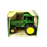 Ertl 1/16 John Deere Sound Gard Dual Wheel Tractor. Nice example is E in Box.