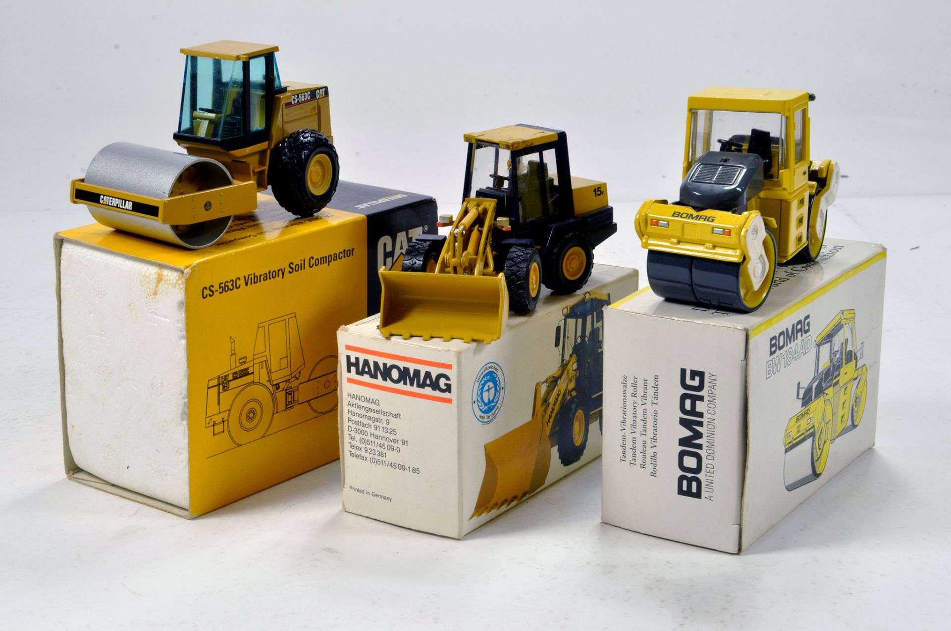 Construction Diecast Trio comprising CAT Soil Compactor, Hanomag wheel loader, Bomag Roller. NZG