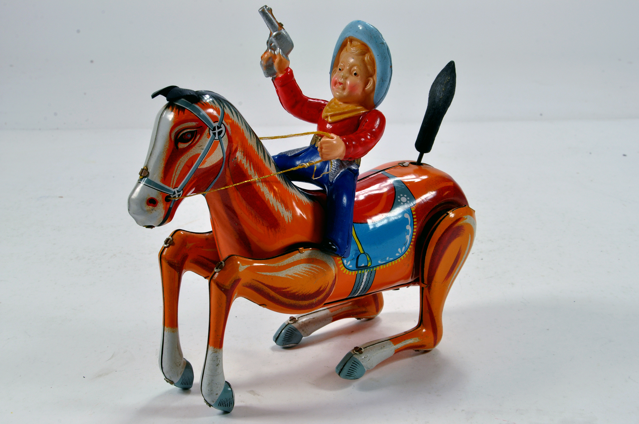 Scarce original issue Cowboy on Horse. Tin Celluloid type issue. Well preserved and displays well.