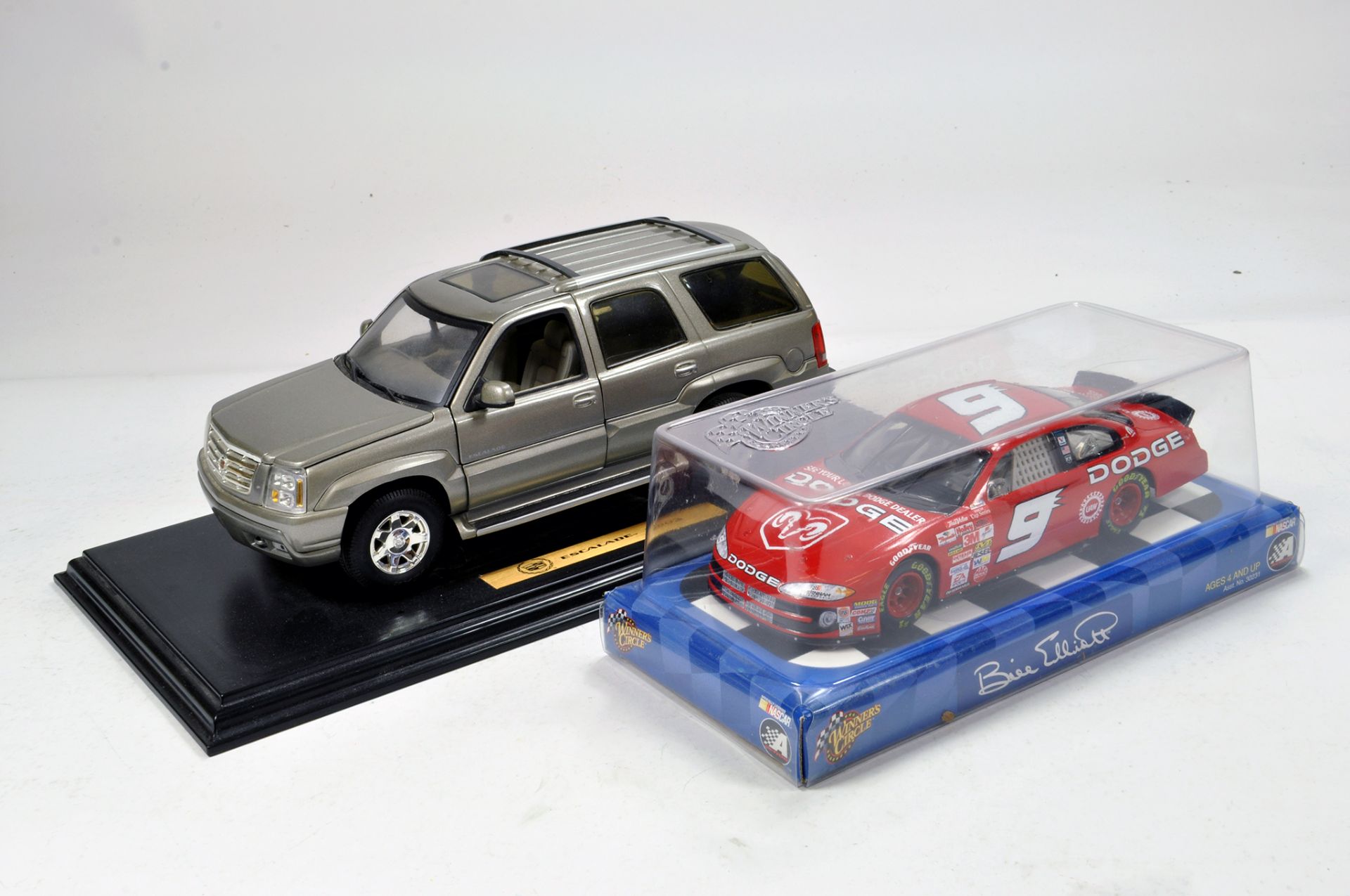 Duo of diecast issues comprising Dodge Nascar plus Escalade. Generally E to NM. (2)