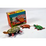 Tomuro (Japan) scarce original issue of the Turtle Family. This bright original Tin Toy displays