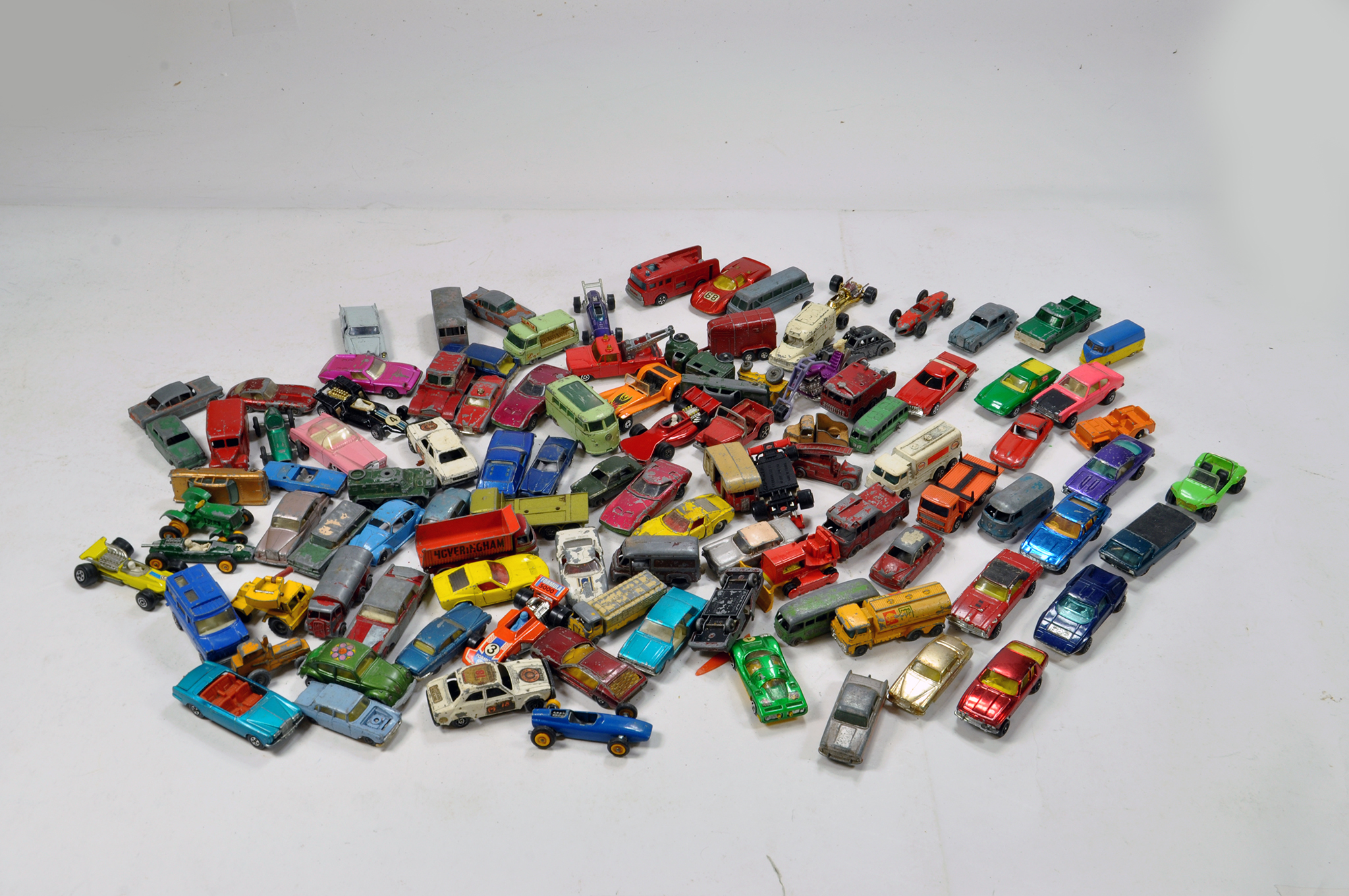 An interesting worn diecast group comprising various makers including Hot Wheels (Redliners),