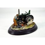 A static presentation piece comprising a Country Artists model featuring a Field Marshall Tractor.