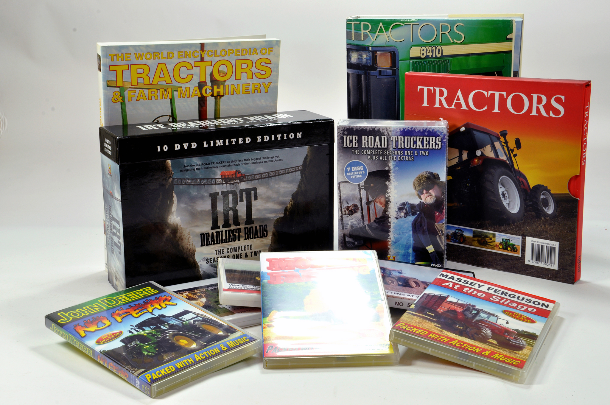 Various Tractor reference books including Ice Road Truckers DVD Set and other items.